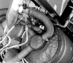 [73698: 3/3/1960]  Top of Liquid Nitrogen Cooling Tank, showing flex tubing that routes cool air to G&C package. Aluminum tubing was high pressure air feeding tank to circulate nitro for cooling.  [CCMD, Ed May]